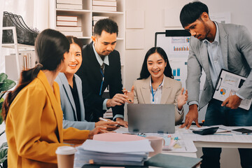 Team of financial advisory services. Asian advisor showing plan of investment to clients in the consultancy office..
