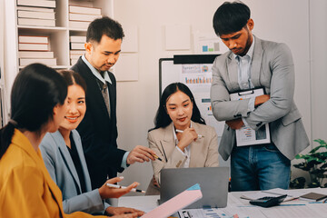 Team of financial advisory services. Asian advisor showing plan of investment to clients in the consultancy office..