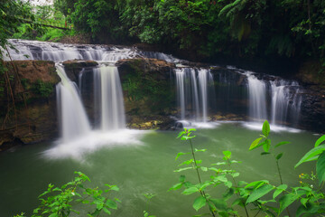 Fototapeta premium panoramic view of Indonesia with morning sun and waterfall in tropical forest