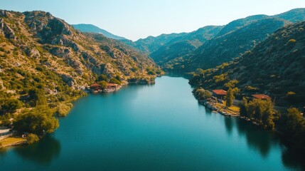 Serene Mountain Lake Paradise: An Aerial View of Tranquil Waters Nestled in Majestic Peaks