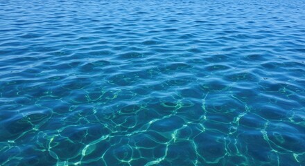 Obraz premium Calm, azure water surface with sunlit ripples. Gentle waves, transparent, shimmering