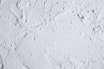 White acrylic illustration textured plaster. Drops, lines, arrows, cracks in close-up. Drawing with a spatula