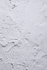 White acrylic textured plaster. Drops, lines, arrows, cracks in close-up. Drawing with a spatula