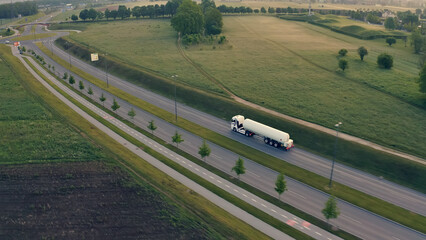 Aerial view of a tanker truck cruising down a highway, symbolizing efficient cargo transportation...