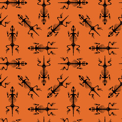 Seamless Pattern for Halloween. Skeletal system of animals. Black lizard bone structure isolated on an orange background. 
