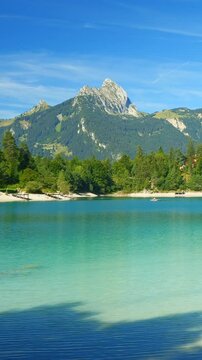 Lakeside relaxation at Urisee in the Tyrolean Alps with turquoise water and untouched nature, perfect alpine summer setting