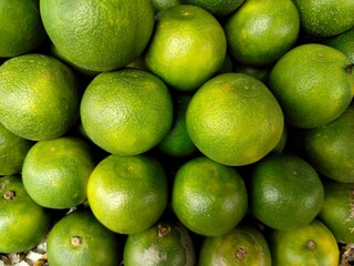 A pile of fresh sweet lime or sweet lemon.