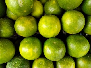 A pile of fresh sweet lime or sweet lemon.