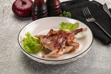 Grilled quail in the plate