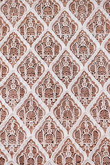 Traditional islamic geometric pattern decorating a wall in Morocco, creating a mesmerizing and ornate design