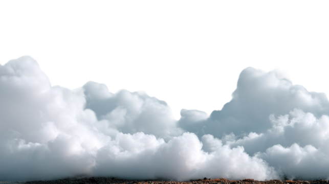 Fluffy clouds in a blue sky over a green field with mountains in the distance
