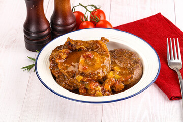Italian cuisine - ossobuco with sauce