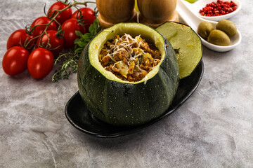 Baked round zucchini with meat