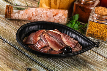 Canned anchovy with oil in the bowl