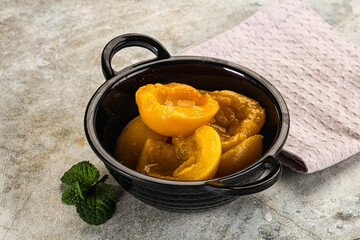 Canned marinated peach in syrop