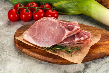 Raw pork steak loin with bone