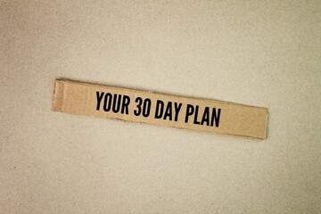Brown paper box  with the words your 30 Day Plan is a strategic outline that encompasses defined...