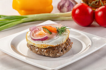 Beefsteak chop with roasted egg