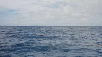 Side view from boat in Indian ocean sailing between Seychelles islands in daytime