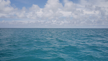 Fototapeta premium Side view from boat in Indian ocean sailing between Seychelles islands in daytime