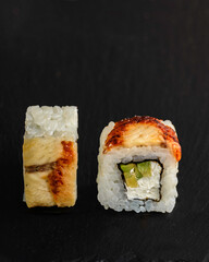 Japanese sushi rolls on a blackboard