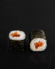 Japanese sushi rolls on a blackboard