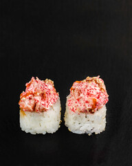 Japanese sushi rolls on a blackboard