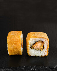 Japanese sushi rolls on a blackboard