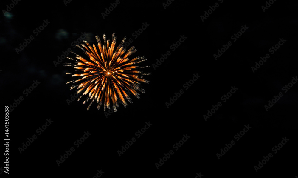 Aufkleber A single, vibrant orange firework explodes against a deep black night sky, creating a stunning circular burst of light and color. : Generative AI