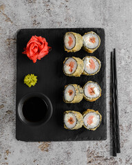 Japanese sushi rolls on a blackboard