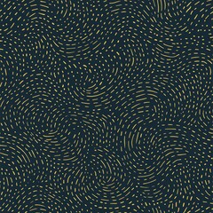 Obraz premium Abstract swirling gold lines on dark navy background