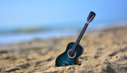 a guitar on the sand the era of concerts by the sea begins