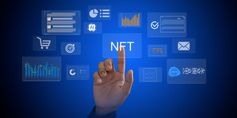 Businessman hand pointing NFT icon on virtual screen, Digital asset blockchain technology concept.