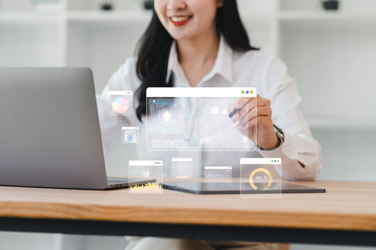 Businesswoman laptop digital tablet data analysis and virtual interface are shown in modern office highlighting technology innovation and professional success - Powered by Adobe