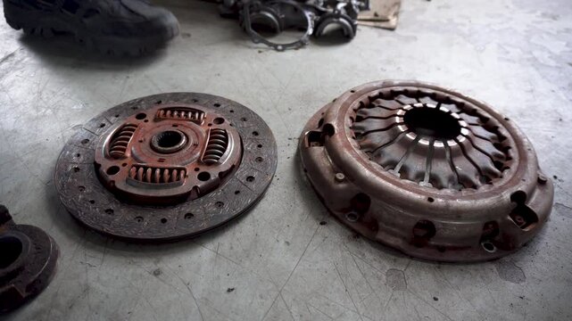 Car service. new and worn car clutch. Car repair concept. Car maintenance