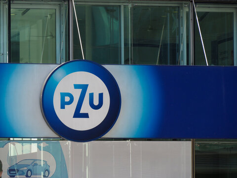 PZU Insurance Company Logo on Blue Sign at Corporate Headquarters Building Entrance