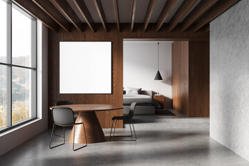 Modern minimalist interior with wooden wall, blank poster mockup, round table, chairs, large window, and cozy bedroom in bright natural light. 3D Rendering