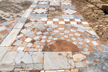 Ancient marble tiled floor at at Caesarea National Park in Caesarea, Israel.
