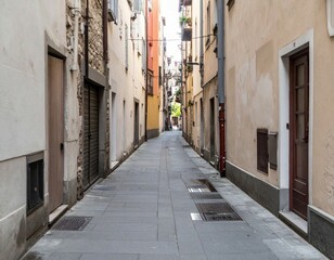 Obraz premium Narrow Urban Alleyway Surrounded by Historic Buildings and Stone Walls