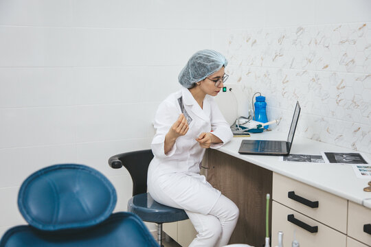 Young female doctor consulting patient via internet using laptop. Telemedicine, medical technologies, video call.