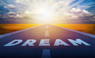 Dream quote on a road and sunset sky. Word motivational quotes.