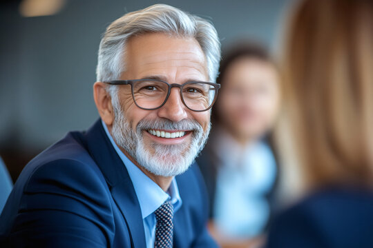 Portrait of a Smiling Senior Businessman in a Modern Office Setting