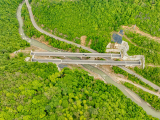 Aerial view of a quiet highway passing through a tunnels in a picturesque hilly region Rikoti Pass
