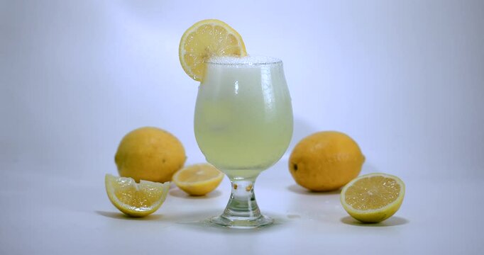 Sparkling Lemonade Pour &ndash; Overflowing Glass
