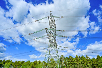 Power poles in spring on the field and meadow, Brandenburg, Germany
