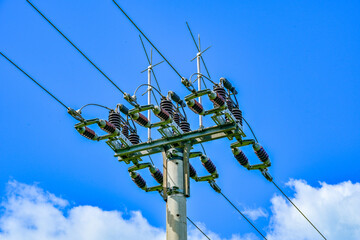 Power poles in spring on the field and meadow, Brandenburg, Germany