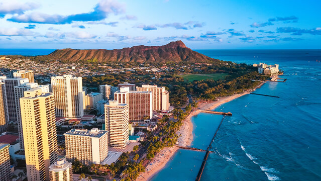 Panorama of Waikiki at the shore of the Pacific Ocean. Aerial perspective on the Diamond Head Crater and blue ocean waterscape.