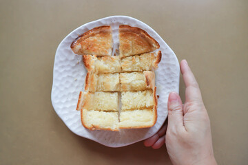 toast or bread with butter topping , toast bread or sliced bread