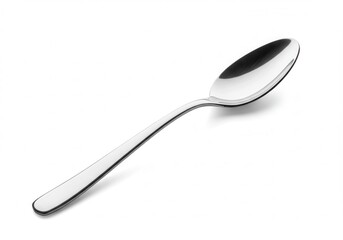Single silver spoon resting on a white surface with a subtle shadow, angled to the right