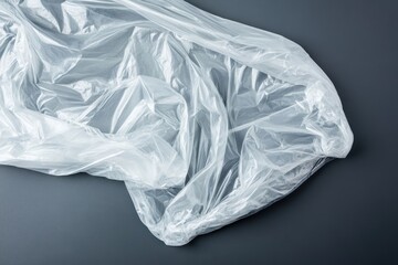 Fototapeta premium Transparent plastic bag on gray surface